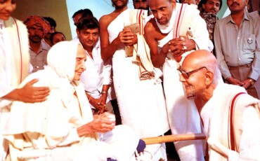 A collective of individuals in white robes and hats, showcasing a spirit of togetherness and shared identity.