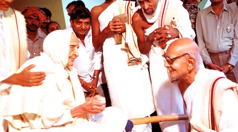 A collective of individuals in white robes and hats, showcasing a spirit of togetherness and shared identity.
